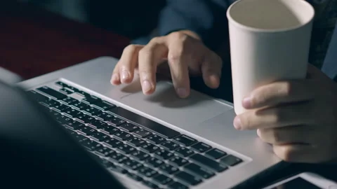 Professional user worker while drink a hot coffee and using typing on lapto.. Stock Footage 322555278