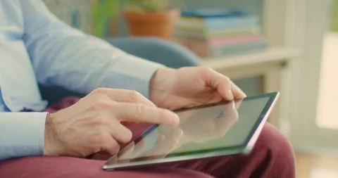 Professional Using Digital Tablet On Sofa At Home 4K Stock Footage 92367473