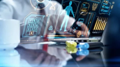 Professional Using Laptop with Advanced Medical Health HUD Interface Stock-Footage 337805653