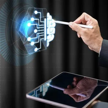 A professional using a stylus to manipulate a glowing digital holographic b.. Stock Photos