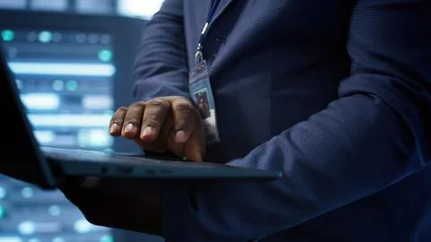 Professional using tablet in tech server room Stock Photos