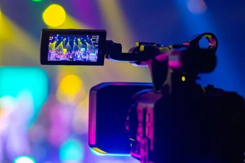 Professional video camera capturing a live concert or event 스톡 사진