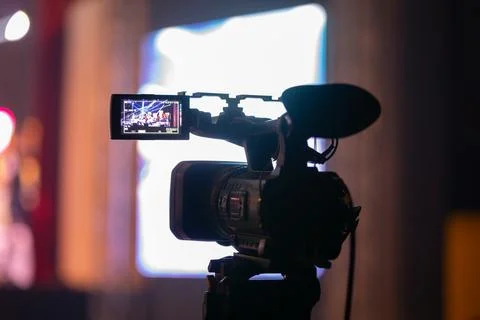 Professional video camera capturing a live concert or event Stock Photos