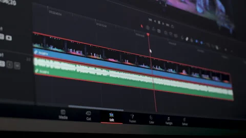 Professional video editing timeline interface with audio waveform Stock Footage 334805024