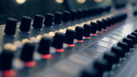 Professional video mixing console where many knobs and many reflections. Closeup Video stock 68370262