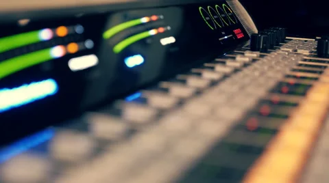 Professional video mixing console where many knobs and many reflections Stock Footage 68370416