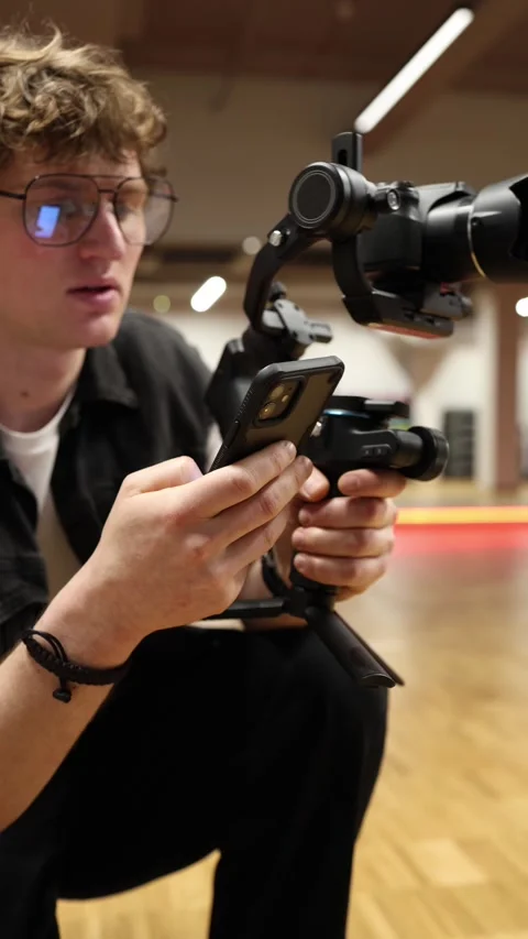 Professional videographer checks settings Stock Footage 332116673