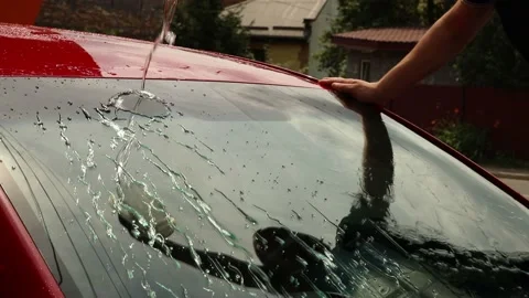 Professional washes the car in black gloves, with a sponge and foam. Concept Stock Footage 144534883