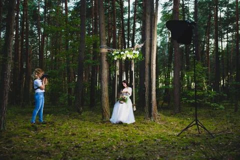 Professional wedding photographer using strobe and softbox to make pictures Stock Photos