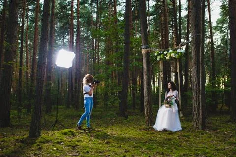 Professional wedding photographer using strobe and softbox to make pictures Stock Photos