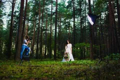 Professional wedding photographer using strobe and softbox to make pictures Stock Photos
