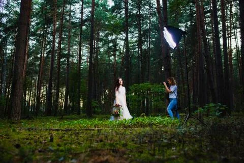 Professional wedding photographer using strobe and softbox to make pictures Stock Photos