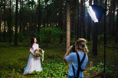 Professional wedding photographer using strobe and softbox to make pictures Stock Photos