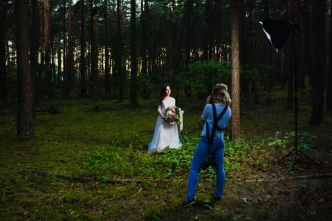 Professional wedding photographer using strobe and softbox to make pictures Stock Photos