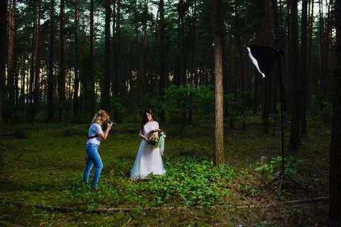 Professional wedding photographer using strobe and softbox to make pictures Stock Photos