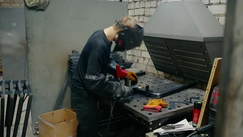 A professional welder performs welding work at his workplace. Stock Footage 152254258