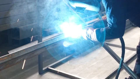 Professional welder, professional worker is welding in workshop Stock Footage 163708653