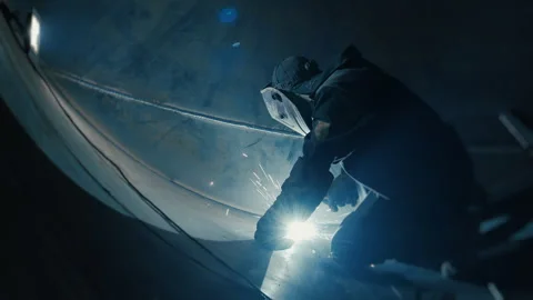 A professional welder works inside a huge tank. Stock Footage 306540495