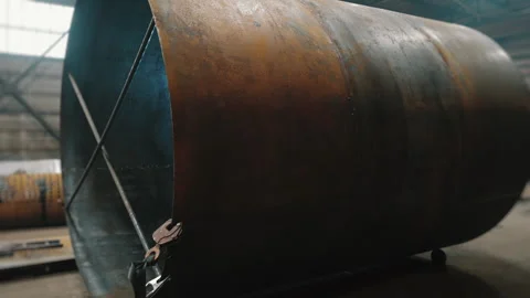 A professional welder works inside a huge tank. Stock Footage 307092880