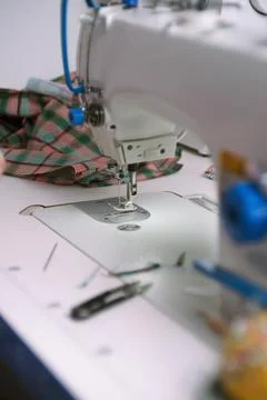 Professional white sewing machine in a tailor workshop Stock Photos