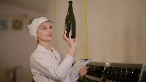 Professional winemaker controlling wine making process and quality at winer.. Stock Footage 286716044