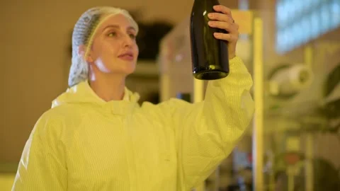 Professional winemaker controlling wine making process and quality at winer.. Stock Footage 286716096