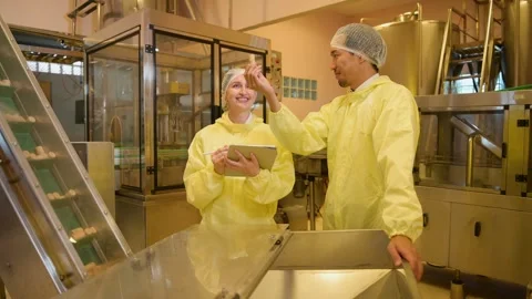 Professional winemaker controlling wine making process and quality at winer.. Stock Footage 286716125