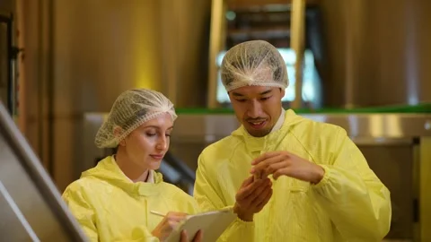 Professional winemaker controlling wine making process and quality at winer.. Stock Footage 286716126