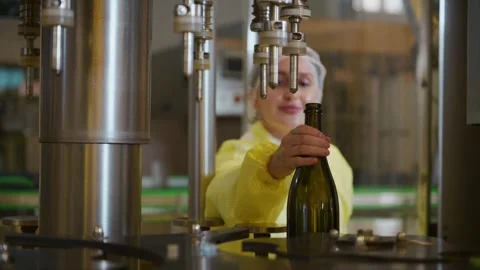 Professional winemaker controlling wine making process and quality at winer.. Stock Footage 286716305