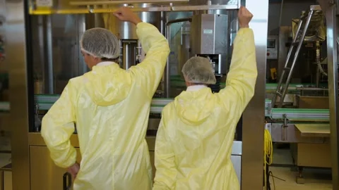 Professional winemaker controlling wine making process and quality at winer.. Stock Footage 286716322