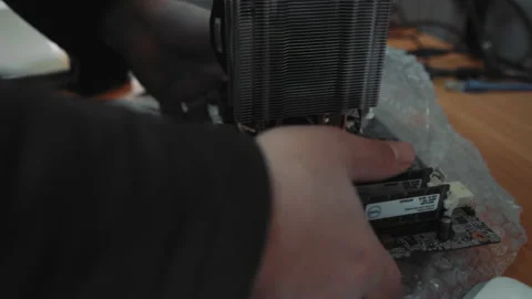 Professional wizard holds in hands part of computer. Close up of hard ware to Stock Footage 134841881