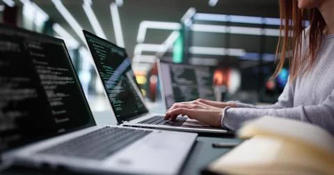 Professional Woman Coding Software on Office Computer Foto stock