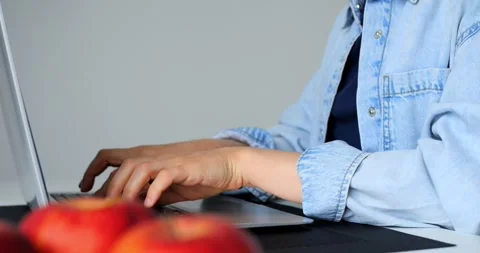 Professional woman practicing preventive hand exercises while working on laptop Stock Footage 316756783