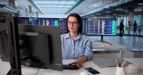 Professional Woman Using Spreadsheet To Audit Financial Accounts On Computer. Stock Photos
