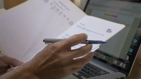 Professional Woman Writes Notes In File Folder Stock Footage 208730039
