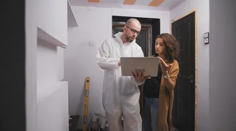 Professional work molar glasses and a client young girl, looking at the laptop Stock Footage 67250238
