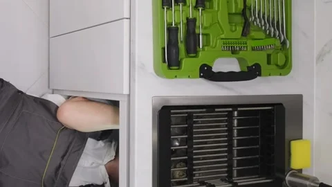 Professional work of a plumber. Cleaning the drain in the sink. Vertical video Stock Footage 250027688
