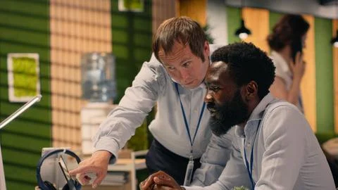 Professional work team discussing project agenda and objectives Stock Photos
