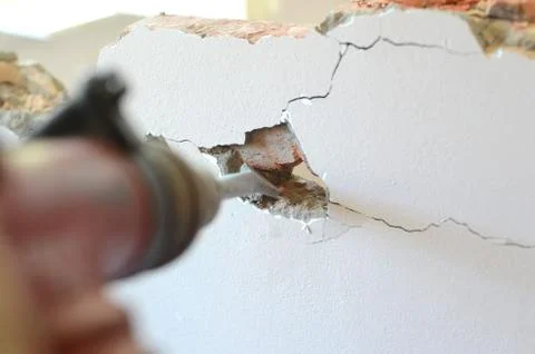 Professional worker in construction site using jackhammer Stock Photos