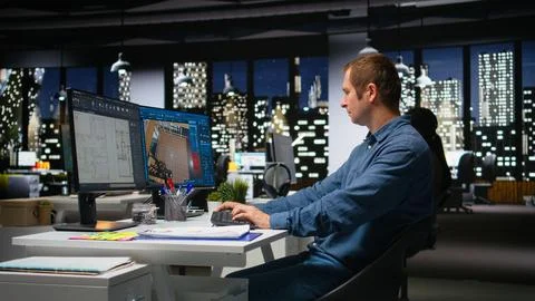 Professional worker in creative office uses CAD software and blueprints plan Stock Photos
