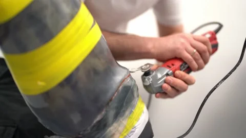 Professional worker cutting prosthetic limb mold in workshop Stock Footage 236622953
