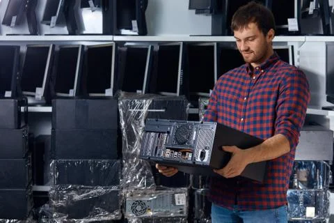 Professional worker fixing problem with system unit Stock Photos