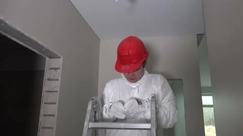 Professional worker install led lighting in the ceiling hole. 4K Stock Footage 151130182