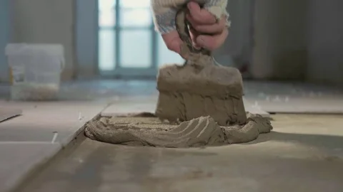 Professional worker laying tiles on floor Stock Footage 83326197