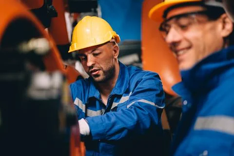Professional worker maintenance machine robotic arms industrial machinery Stock Photos
