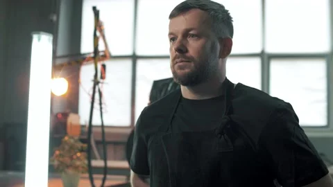 Professional worker in a private production facility goes to his machine Stock Footage 179686495