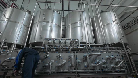 Professional Worker Turns Valves On Bright Beer Brewery Tank Equipment Vídeos de archivo 220895523