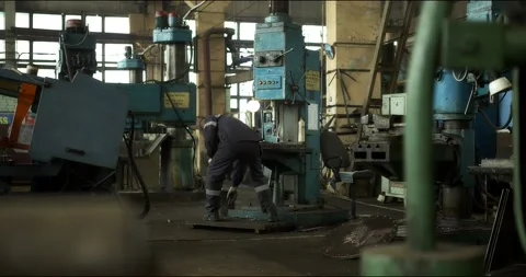 A professional worker in uniform at a lathe. Stock Footage 166146963