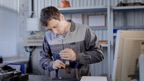 Professional worker using special device for metal parts indoor. Video stock 94997369