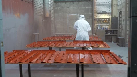 Professional worker using spray gun, applies coating composition, production Stock Footage 120064305